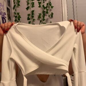 White cross over bell sleeved shirt.